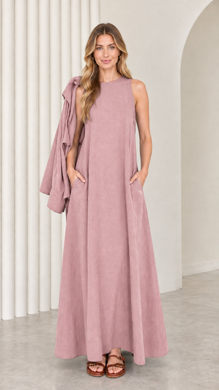 Front full-length view of model wearing the dusty pink sleeveless maxi dress with matching drape