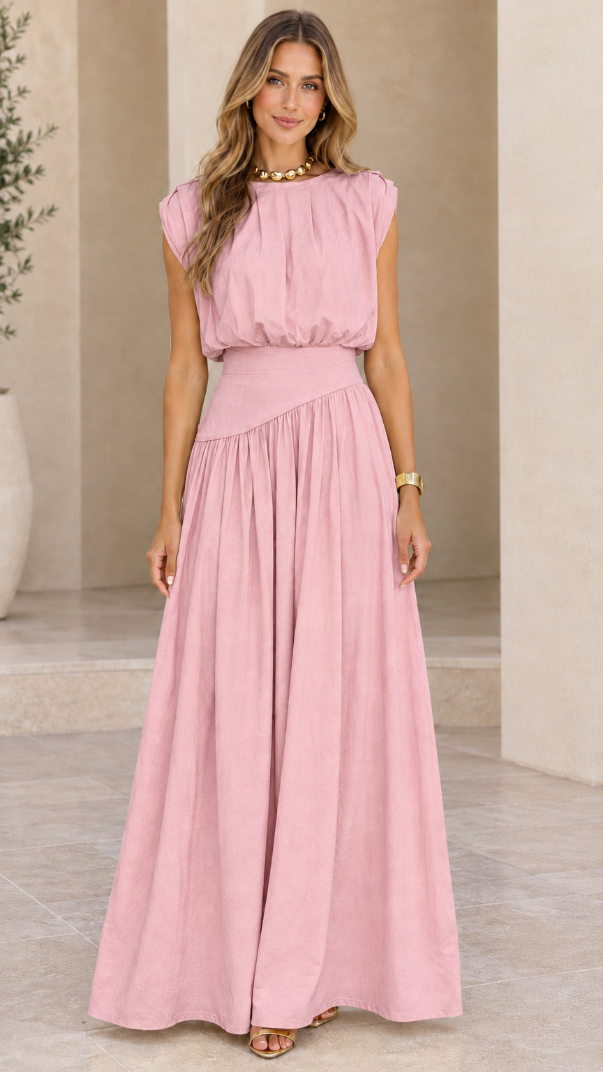Model wearing dusty pink sleeveless pleated waist maxi dress