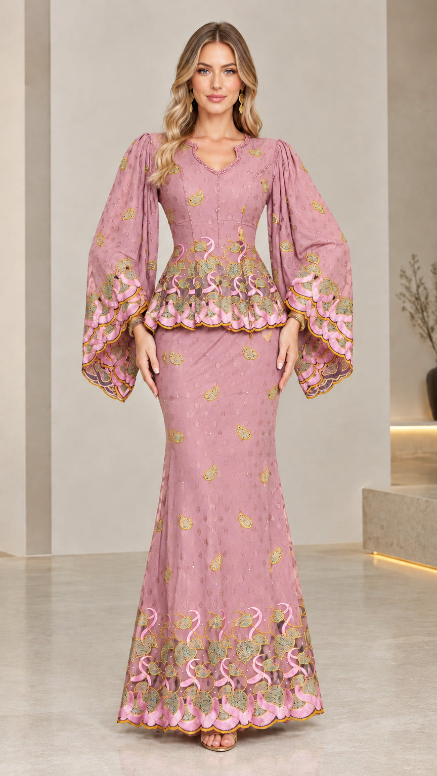 Front view of model wearing dusty pink embroidered peplum maxi dress set