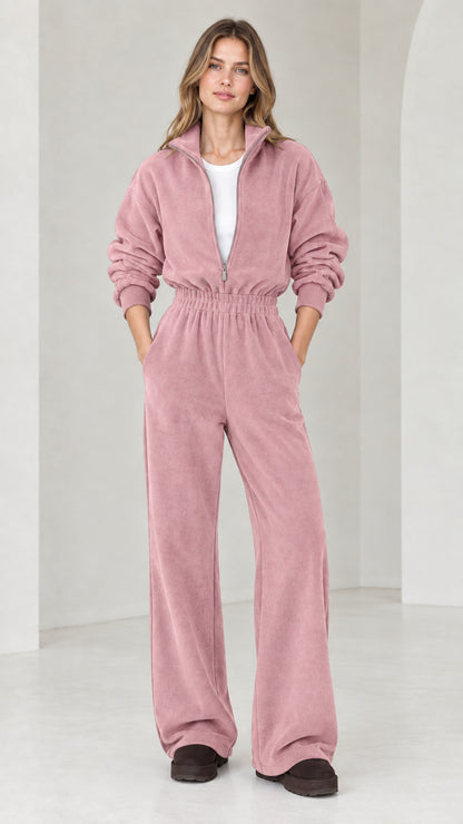 Front view of model wearing dusty rose pink half-zip wide leg fleece jumpsuit