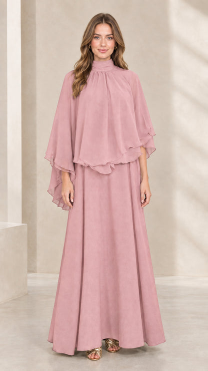 Front view of woman wearing dusty pink mock neck capelet maxi dress