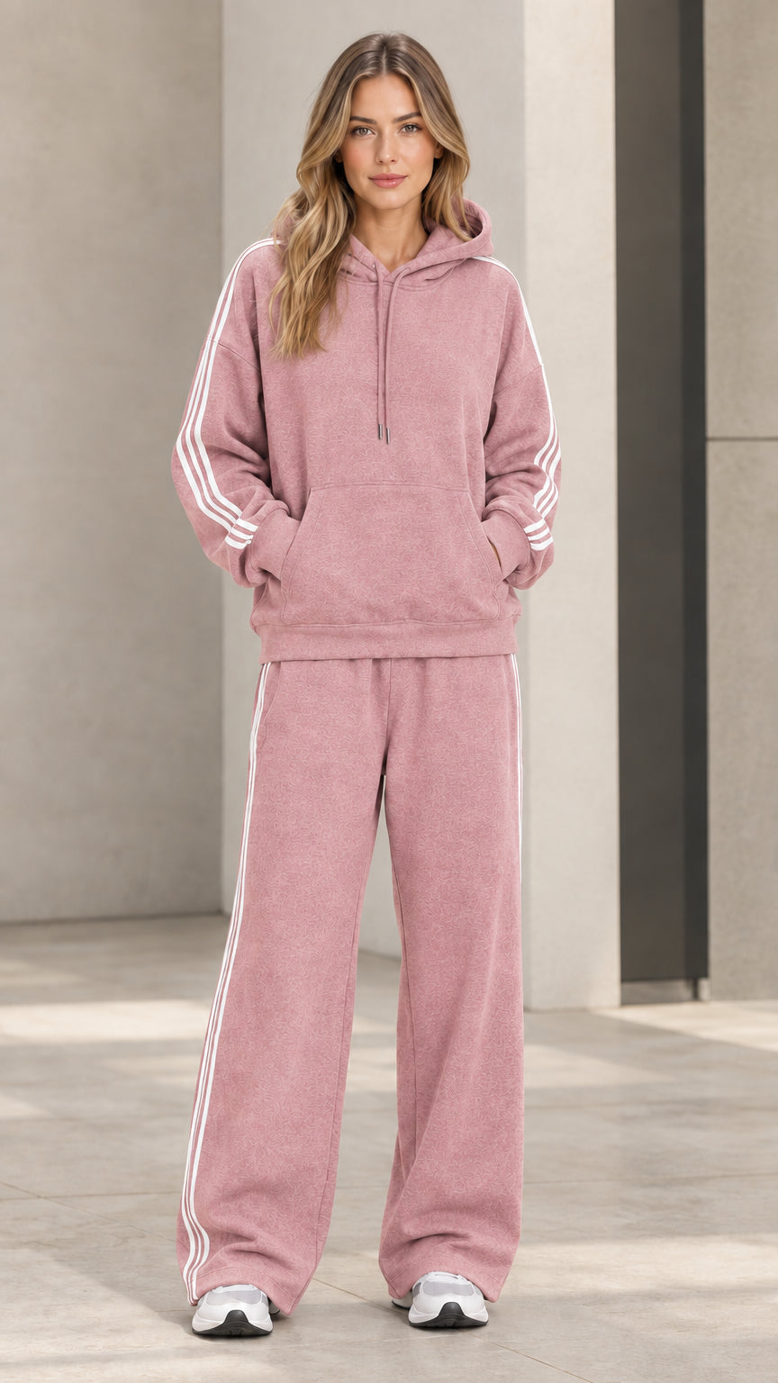Model wearing dusty pink 2-piece striped hoodie and wide-leg sweatpants set