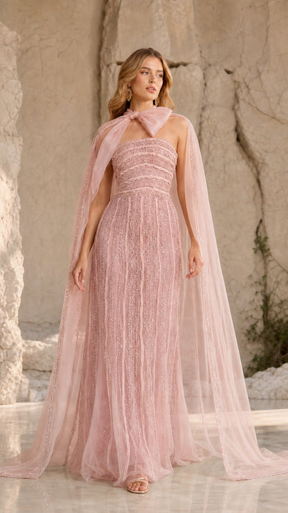 Blush pink strapless beaded evening gown with matching sheer bow-neck cape