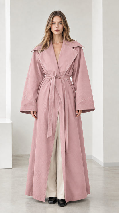 Full-length view of woman wearing dusty pink maxi trench coat