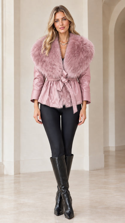 Front view of model wearing dusty pink faux leather jacket with matching pink faux fur collar