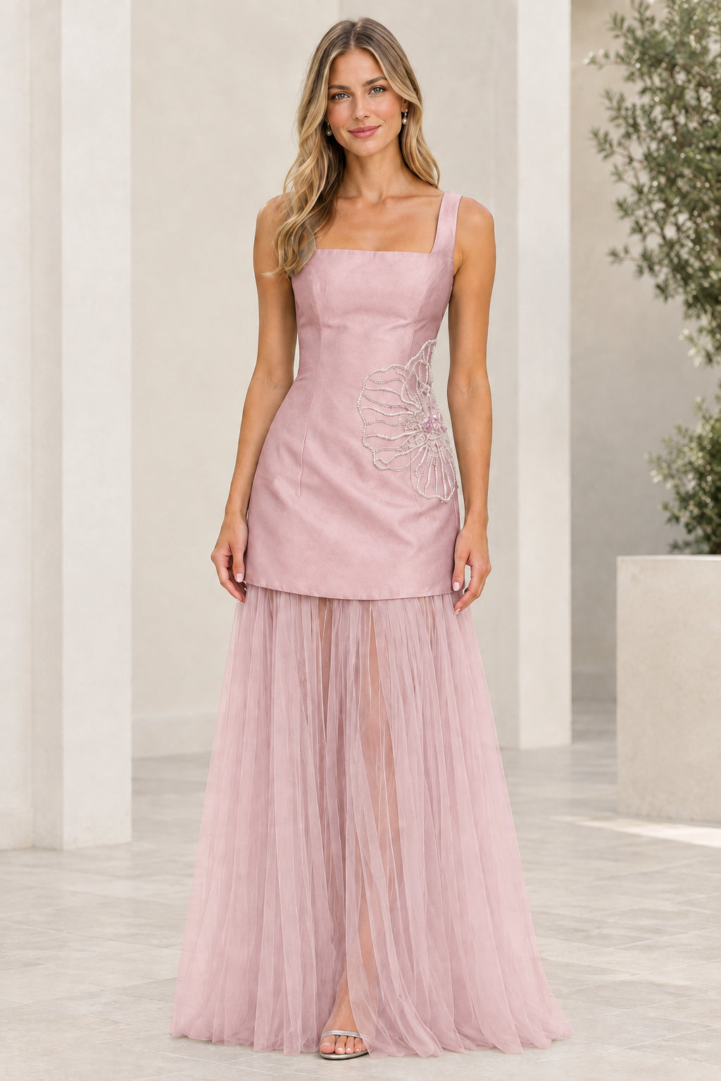 Front view of blush pink embroidered square neck gown with sheer tulle skirt