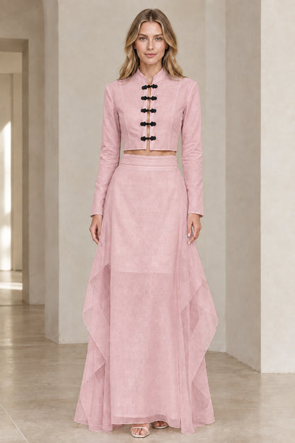Front view of model wearing soft pink mandarin collar crop top and maxi skirt set