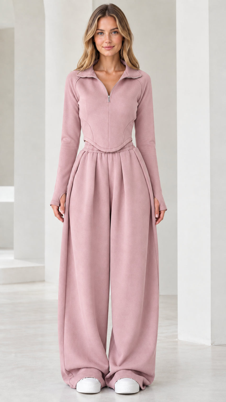 Full-length front view of model wearing dusty rose pink quarter-zip top and wide-leg pants set