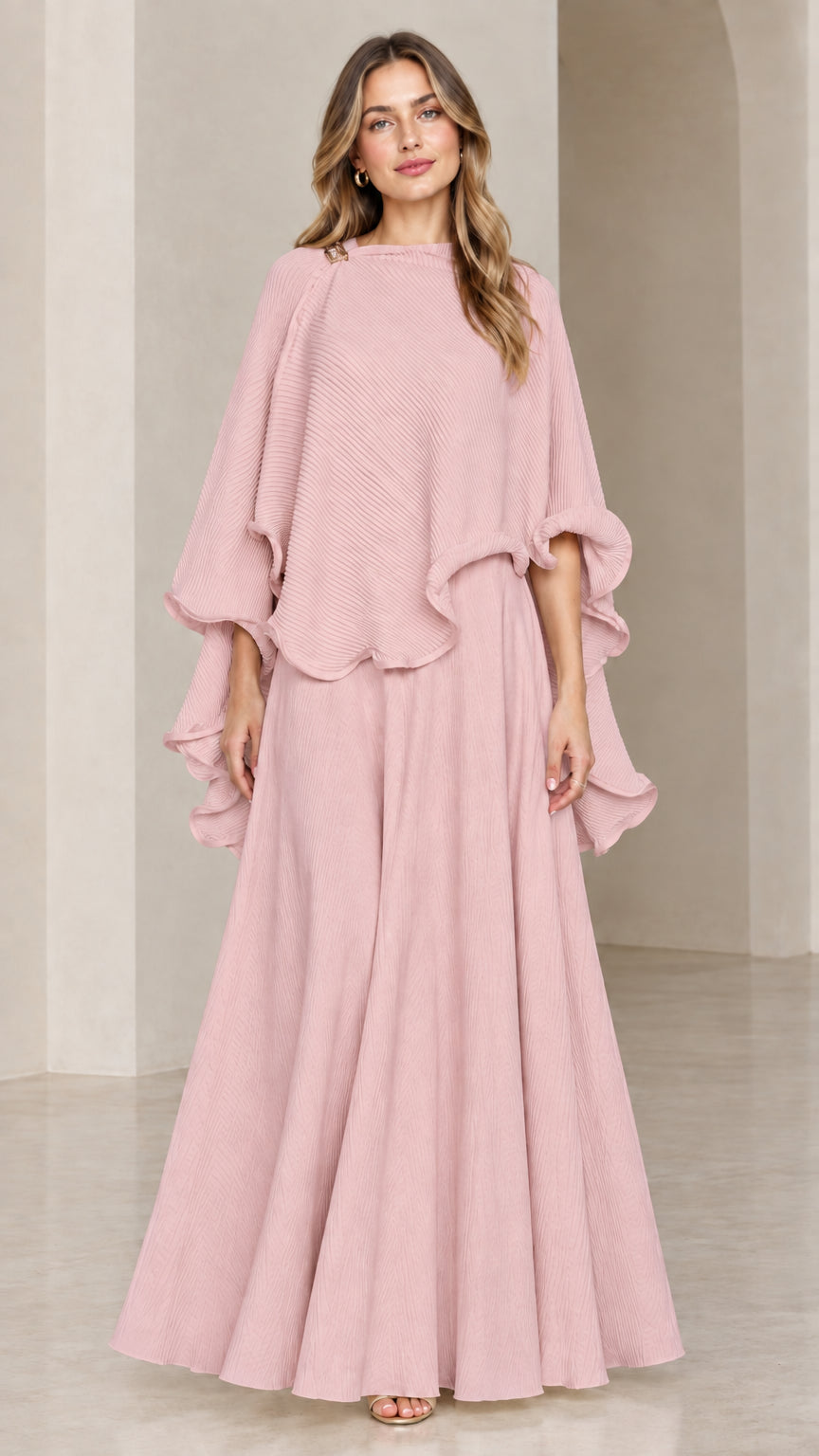 Model wearing dusty pink ruffle capelet top and matching maxi skirt set