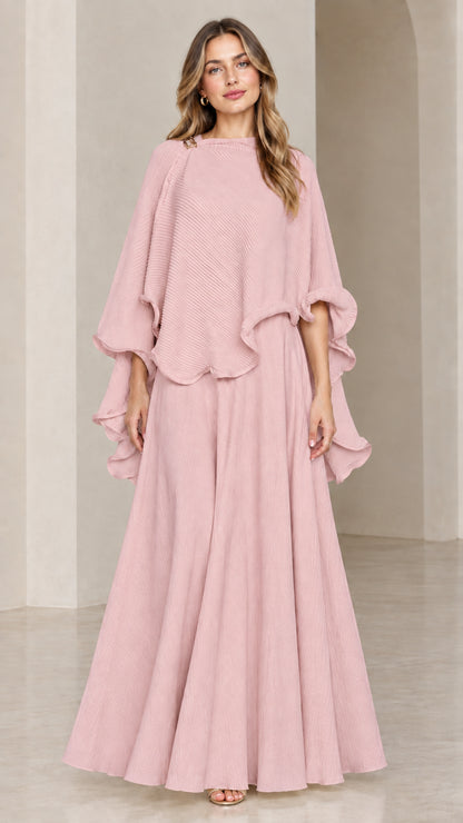 Model wearing dusty pink ruffle capelet top and matching maxi skirt set