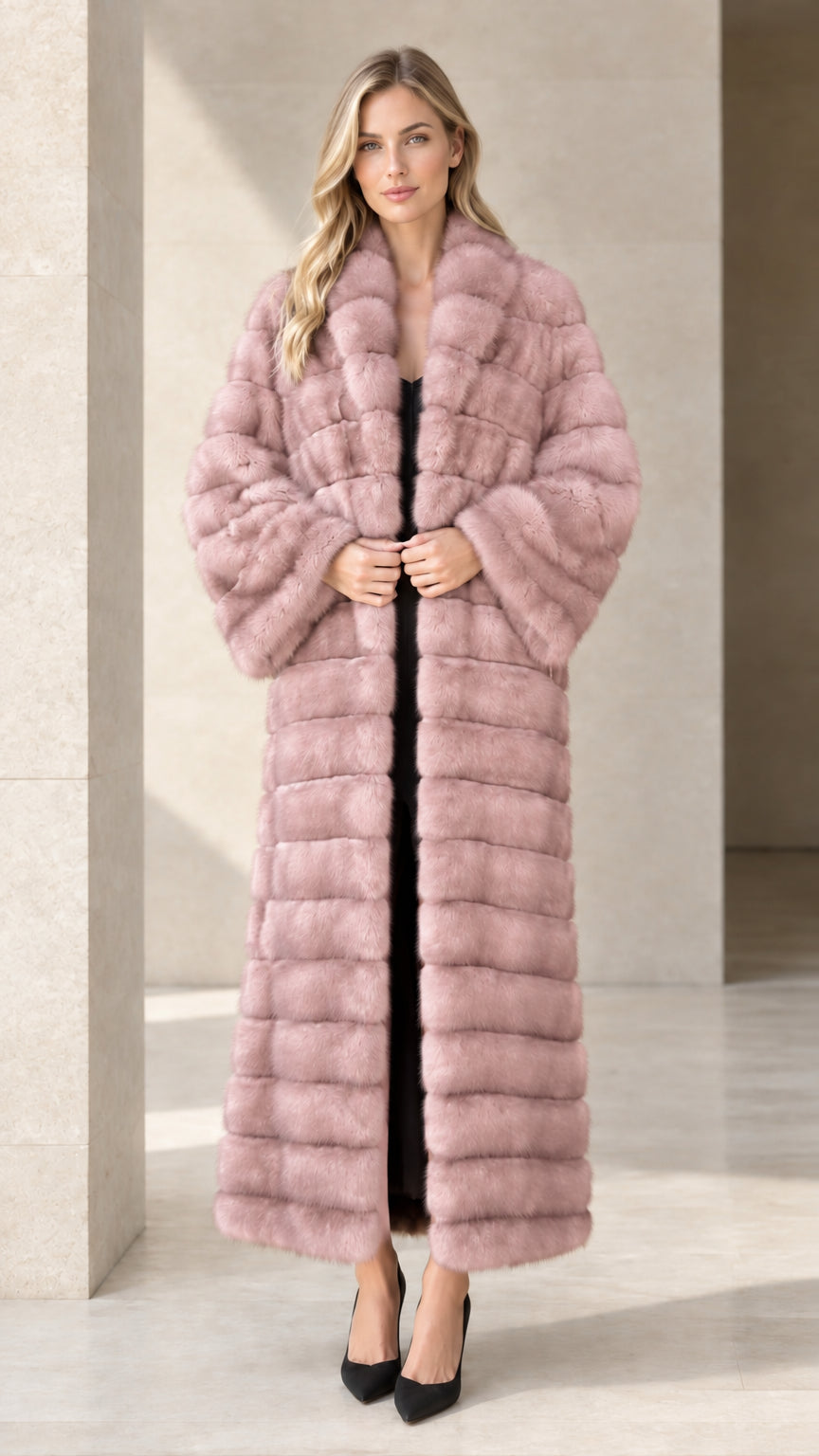 Model wearing dusty pink horizontal paneled faux fur maxi coat