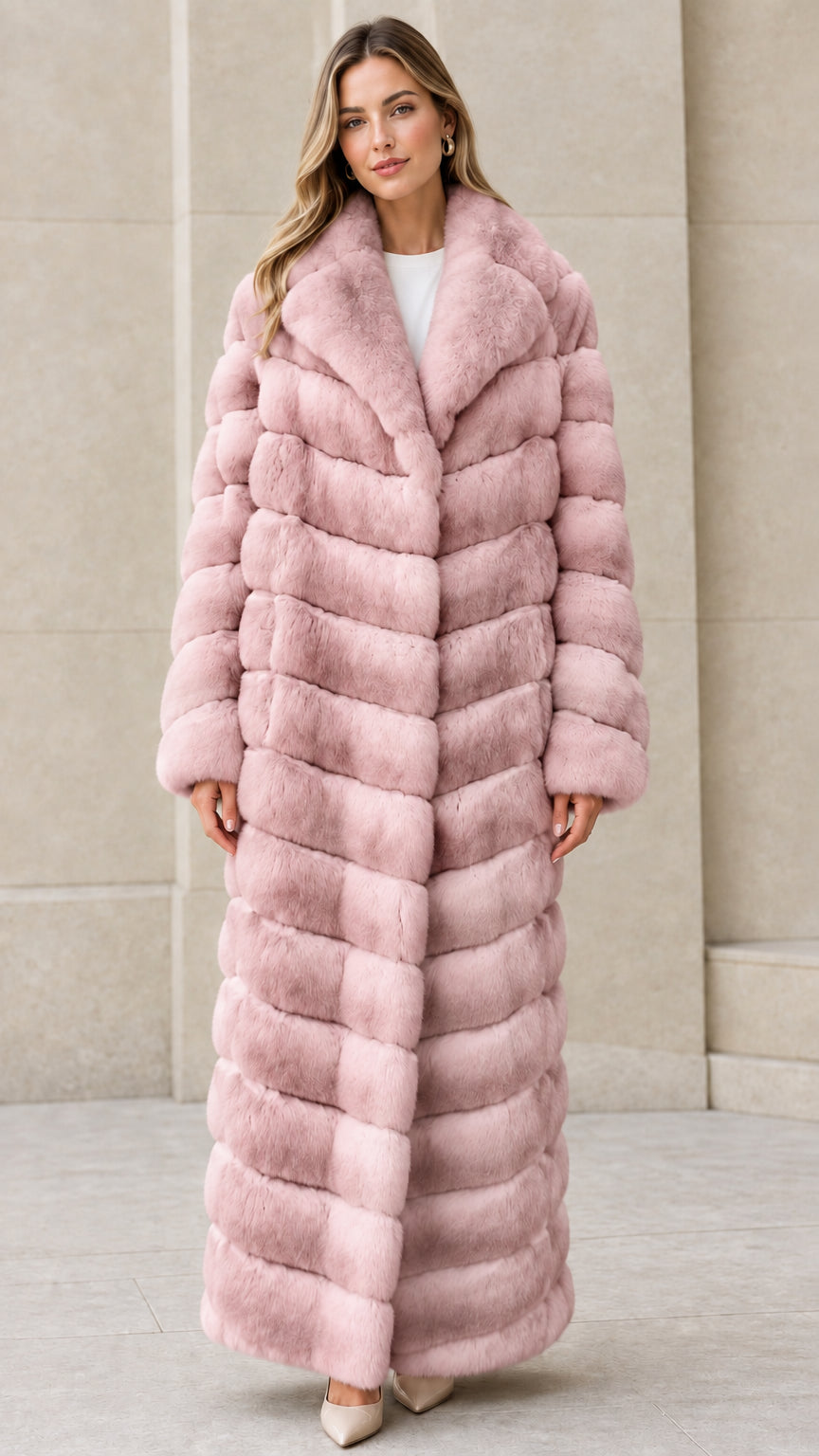 Front full-length view of model wearing Dusty Pink chevron maxi faux fur coat
