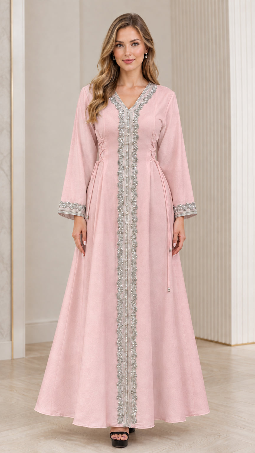 Full-length view of woman wearing blush pink embroidered maxi kaftan dress