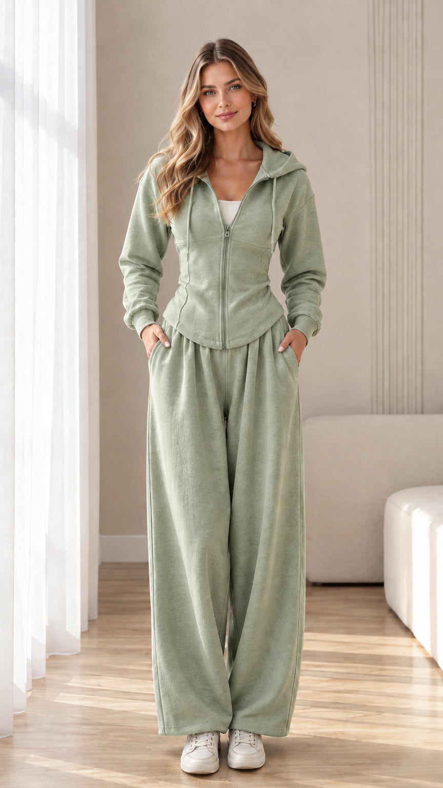 Front view of model wearing sage green corset hoodie and wide-leg sweatpants set