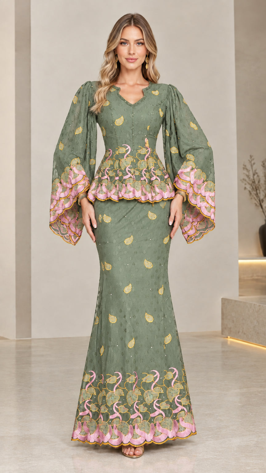 Front view of model wearing sage green embroidered peplum maxi dress set