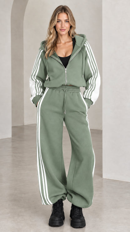Front view of model wearing sage green two-piece striped tracksuit set