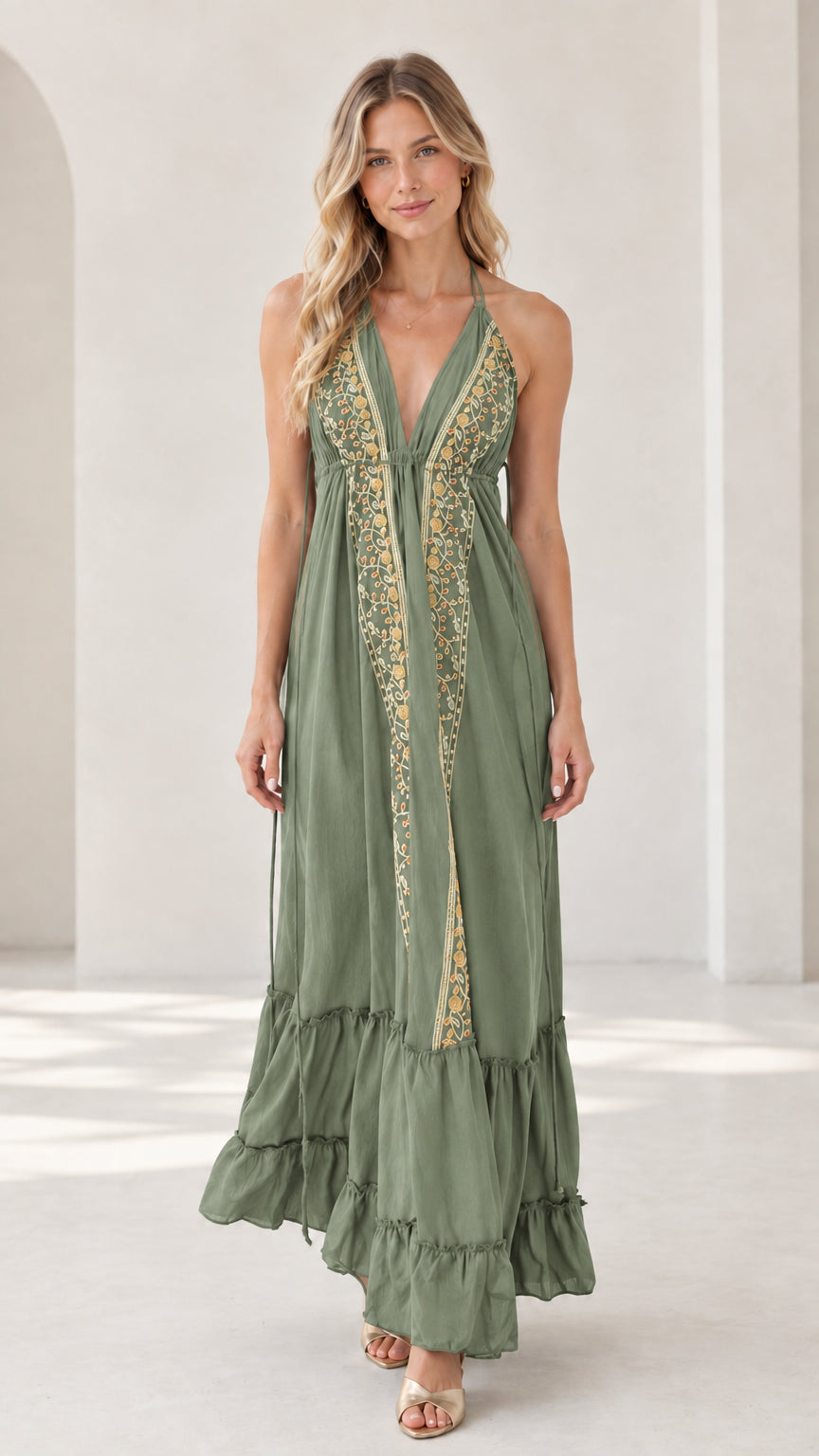 Model wearing sage green embroidered halter maxi dress