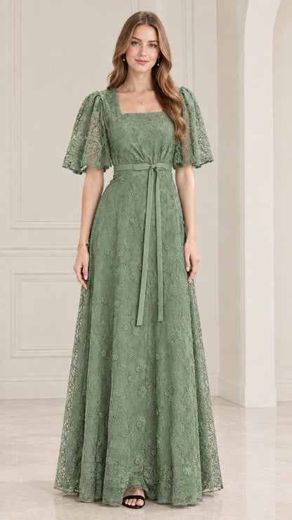 Front view of model wearing sage green embroidered lace evening dress
