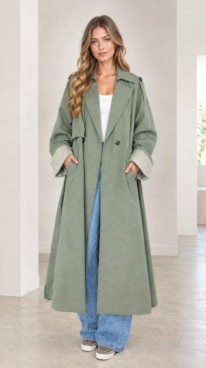 Front full-length view of woman wearing the sage green oversized maxi trench coat