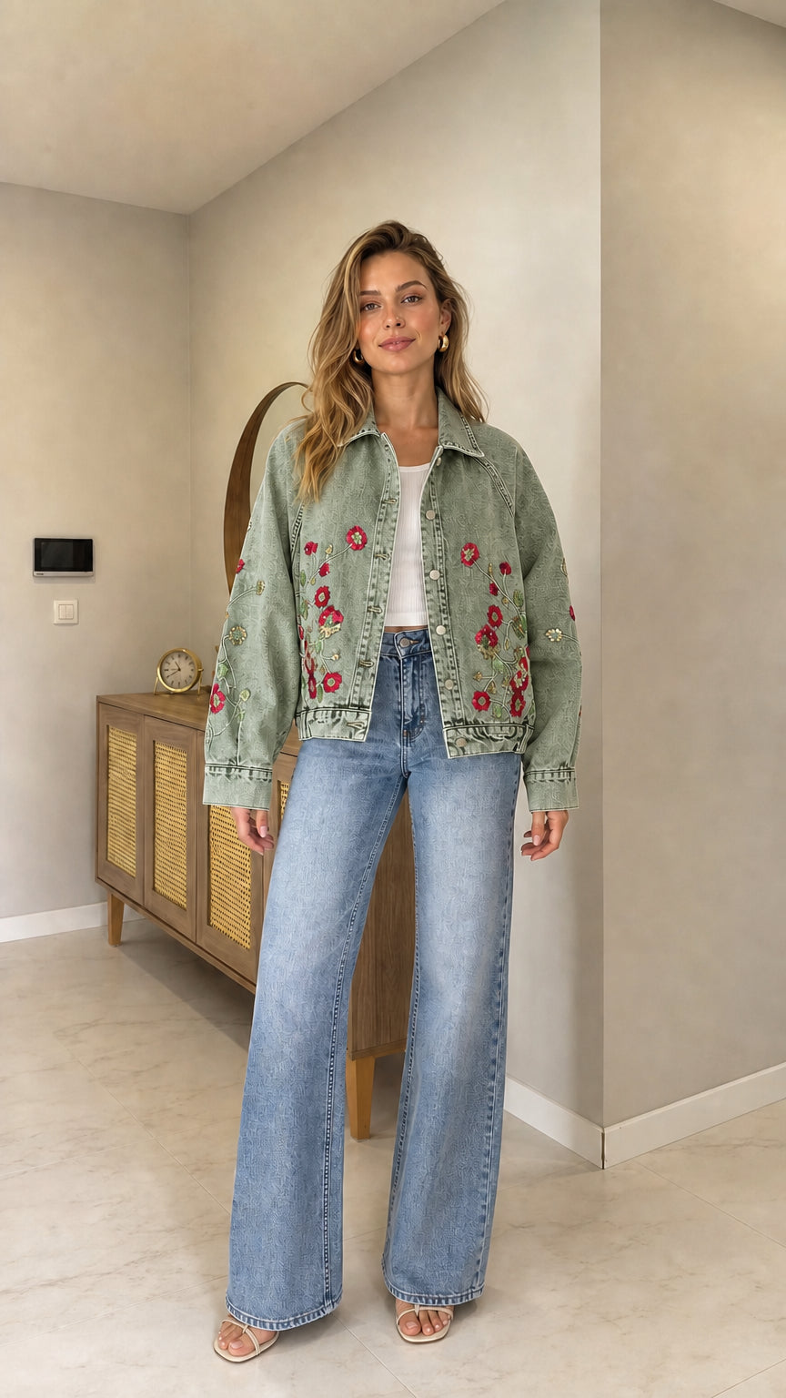 Full front view of woman wearing Sage Green floral embroidered denim jacket with wide-leg jeans