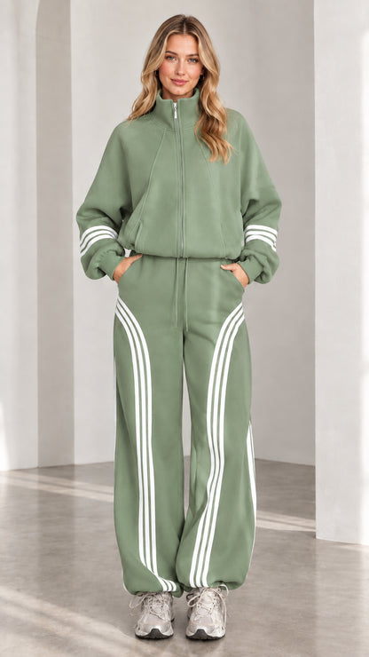 Front view of woman wearing sage green two-piece striped tracksuit set
