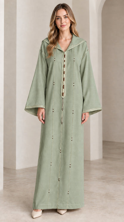 Front view of woman wearing sage green hooded djellaba kaftan maxi dress