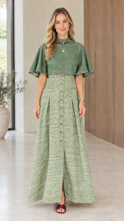 Model wearing sage green monochromatic flutter sleeve tweed maxi dress