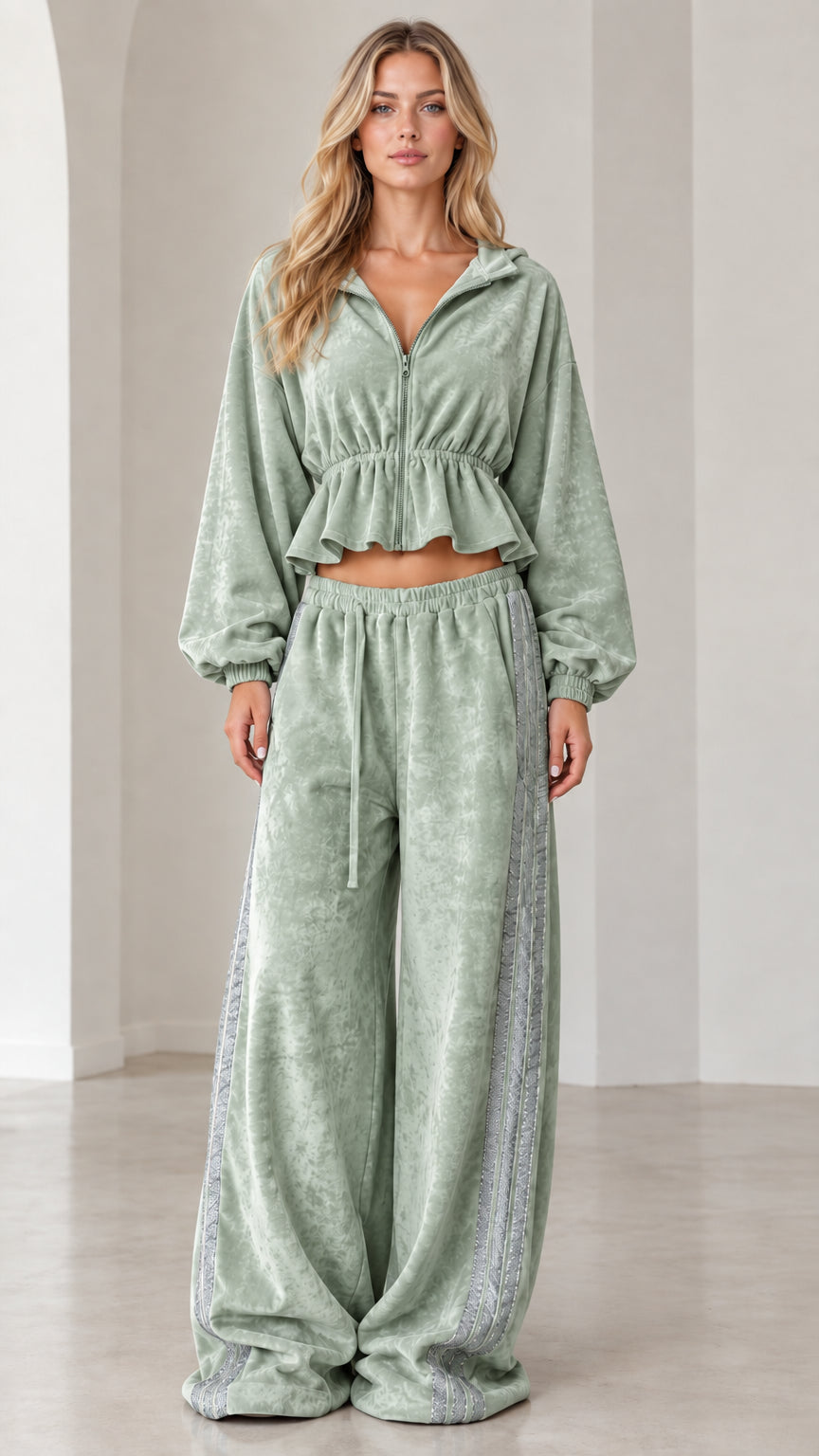 Full-length view of model wearing sage green velour cropped tracksuit set with wide-leg pants