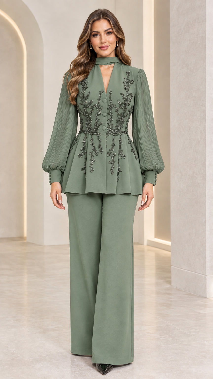 Full front view of sage green beaded peplum trouser suit
