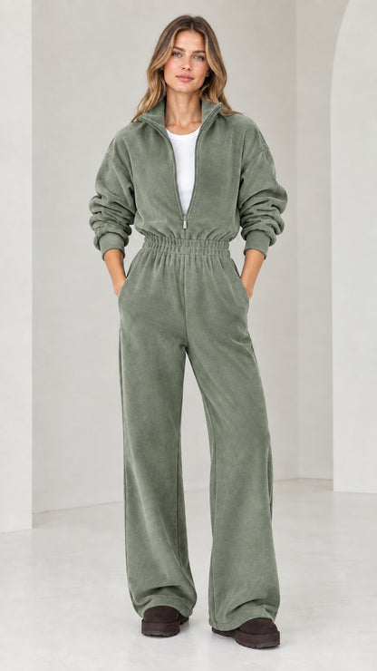 Front view of model wearing sage green half-zip wide leg fleece jumpsuit