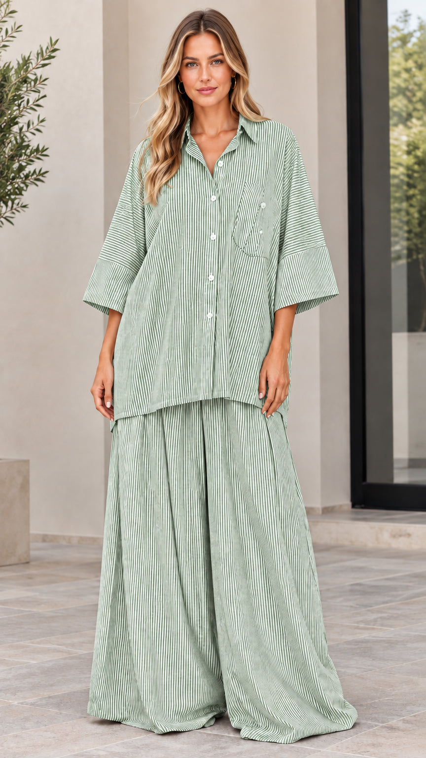 Woman wearing sage green and white striped matching two-piece shirt and trouser set