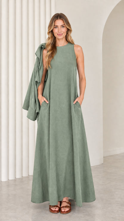 Front full-length view of model wearing the sage green sleeveless maxi dress with matching drape