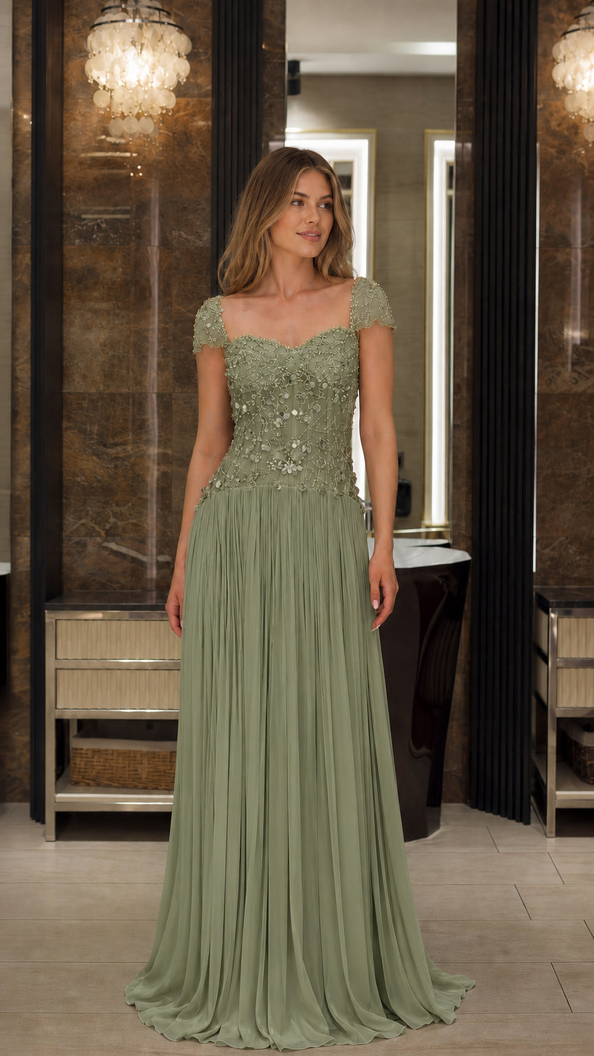 Front view of model wearing the Sage Green beaded cap sleeve pleated formal gown