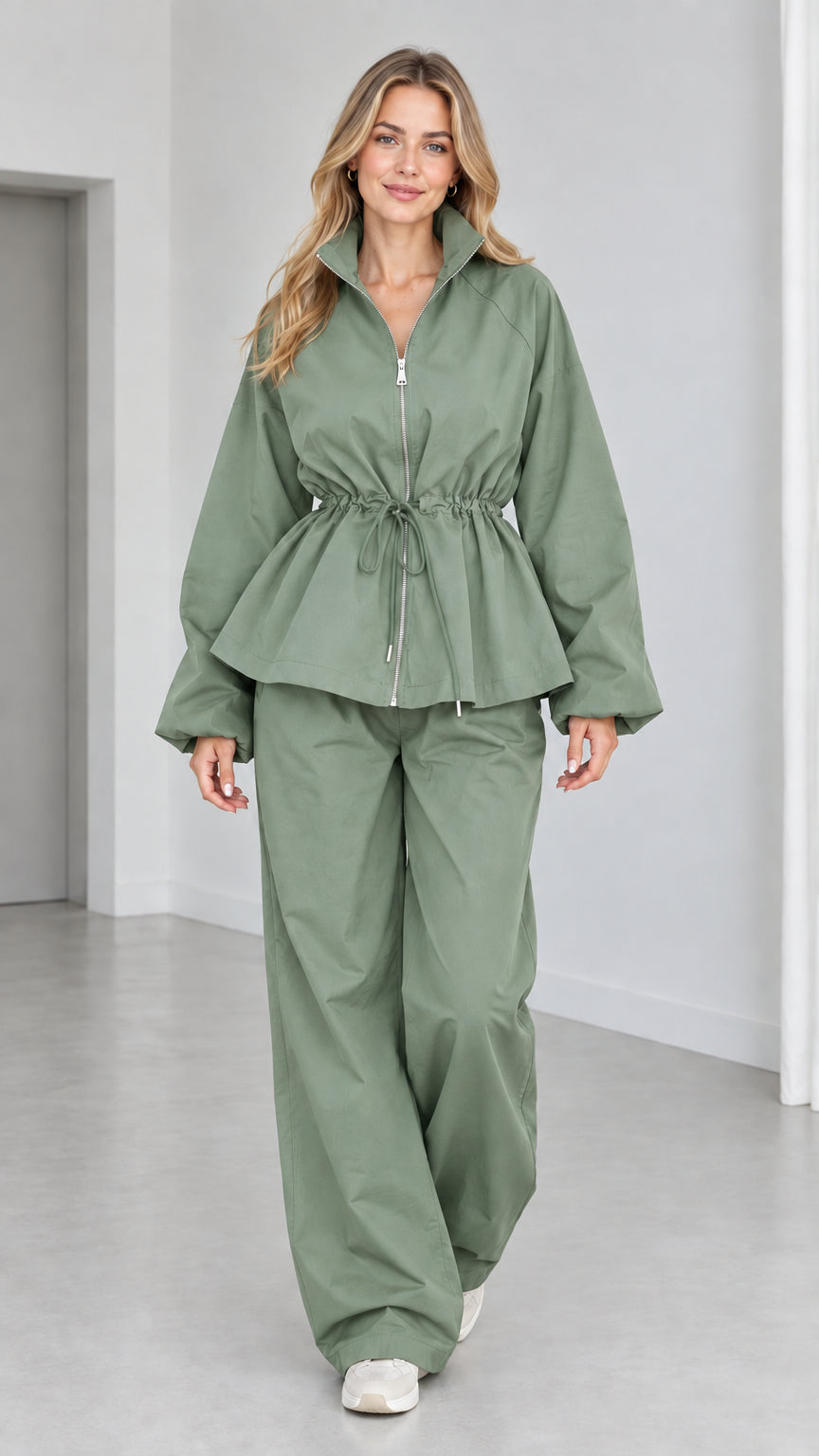 Women's sage green zip-front peplum jacket and matching wide-leg pants set