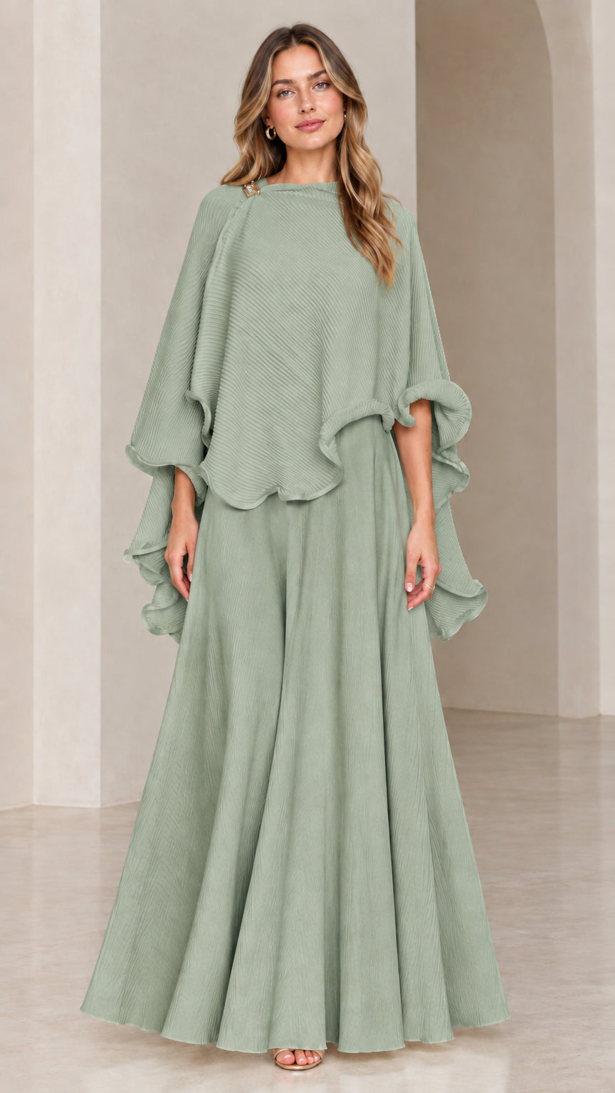 Model wearing sage green textured capelet top and maxi skirt set
