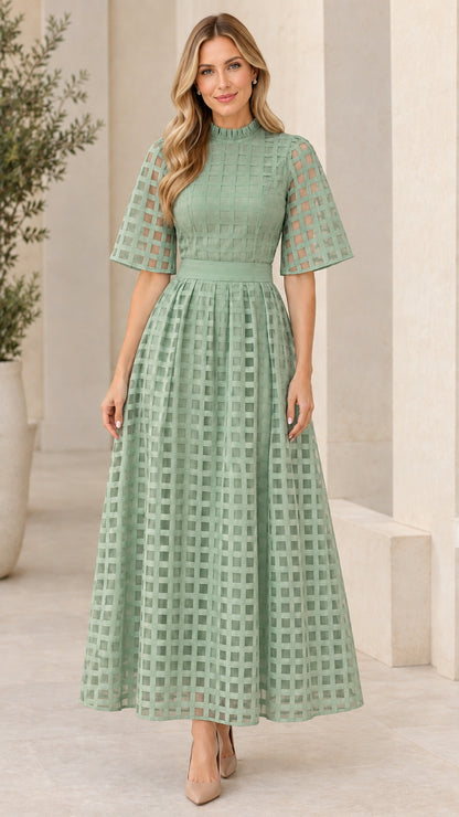 Front view of sage green mock neck sheer grid overlay maxi dress