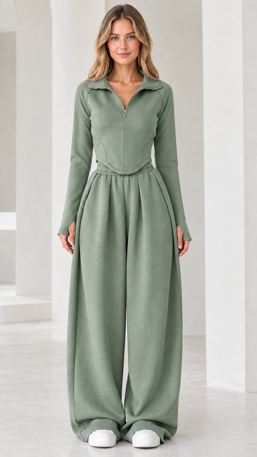 Full-length front view of model wearing sage green quarter-zip top and wide-leg pants set