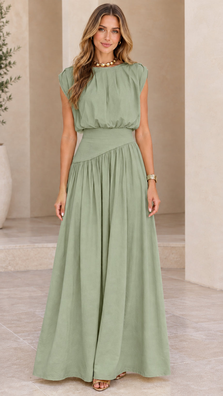 Model wearing sage green sleeveless pleated maxi dress