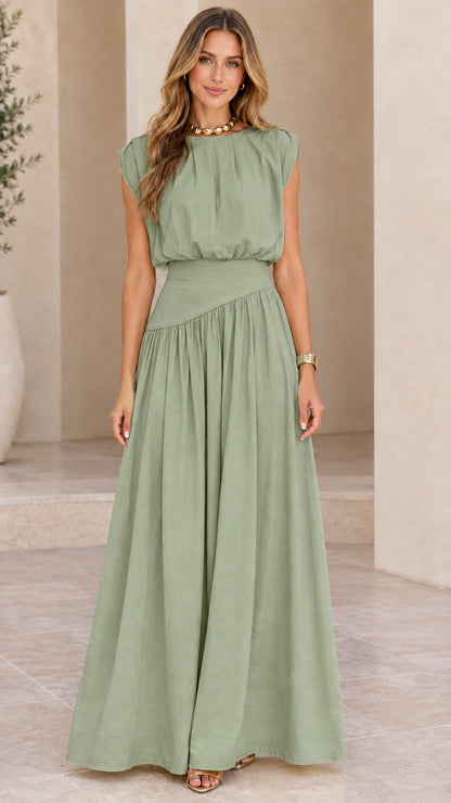 Model wearing sage green sleeveless pleated maxi dress