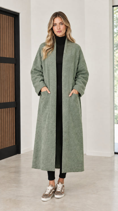 Front view of model wearing sage green open front maxi coatigan