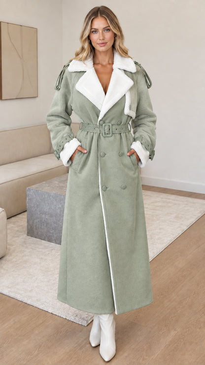 Full-length front view of woman wearing sage green faux shearling maxi coat