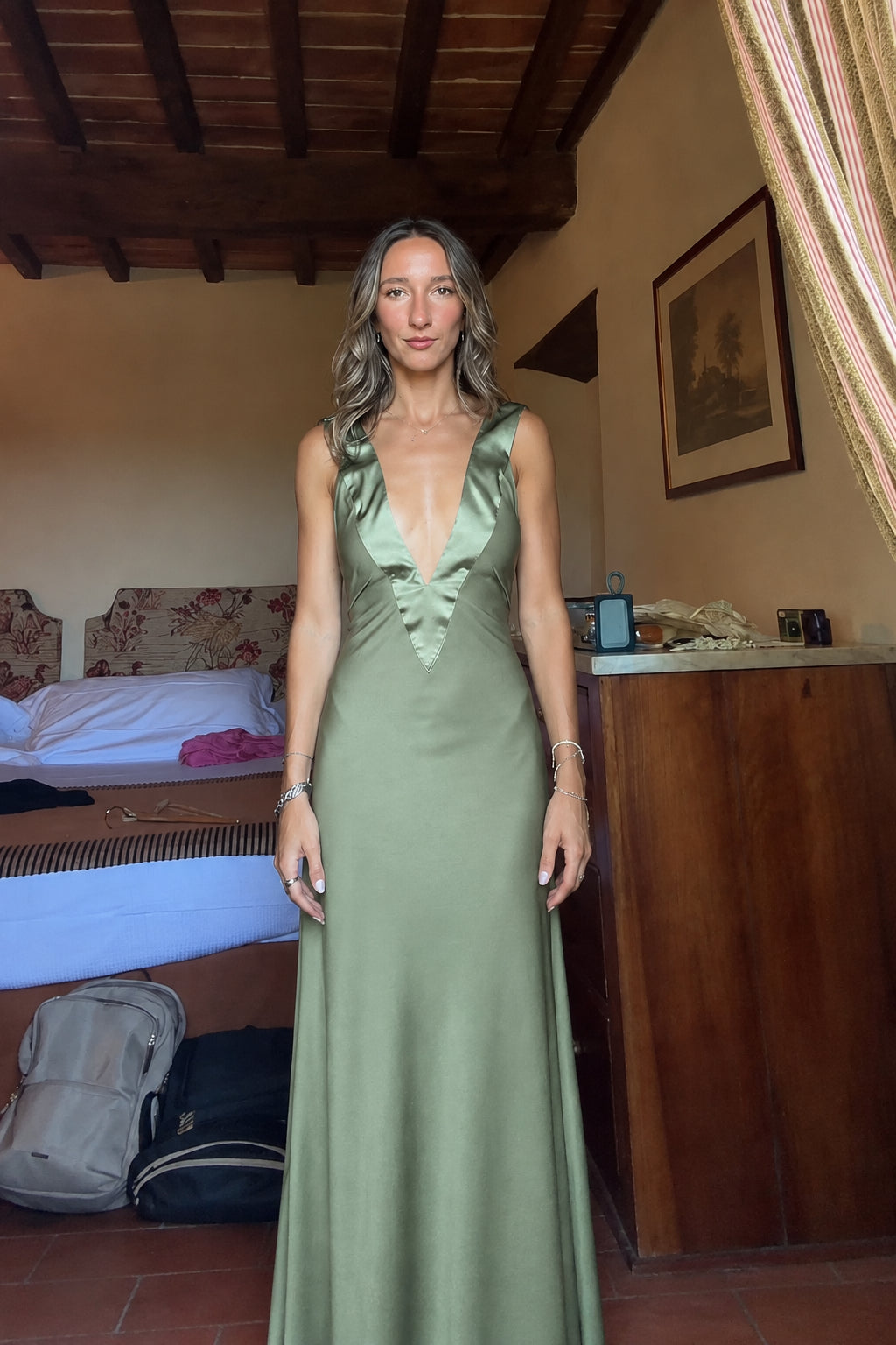Front view of sage green deep V-neck satin maxi dress