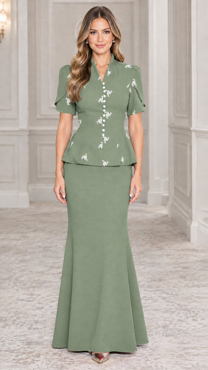 Front view of sage green embroidered peplum top and fluted maxi skirt set