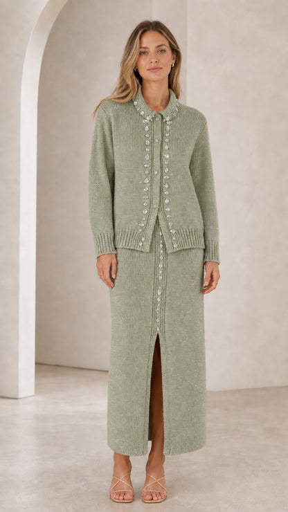 Front view of woman wearing sage green rhinestone-embellished knit cardigan and maxi skirt set