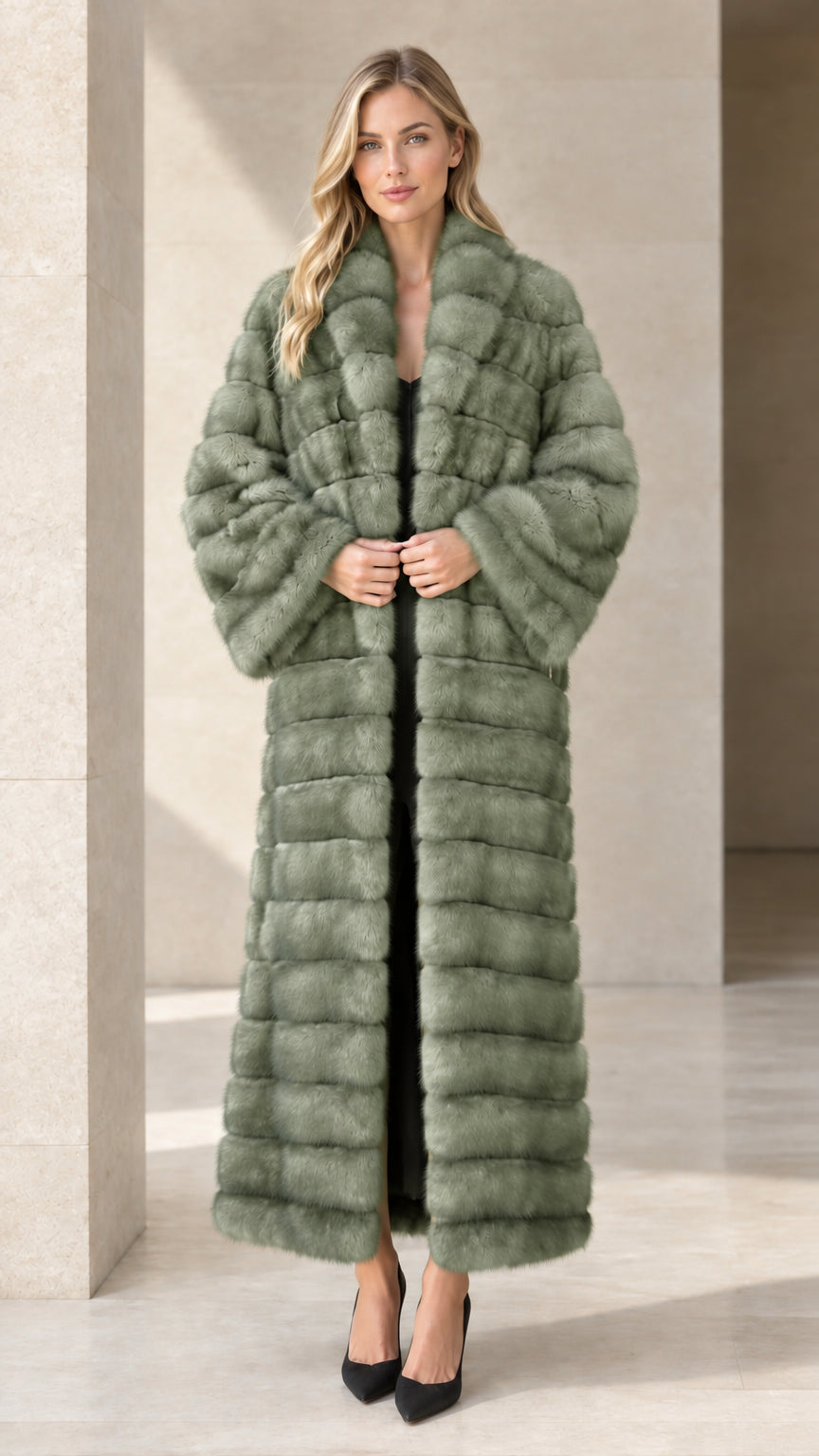 Model wearing sage green horizontal paneled faux fur maxi coat
