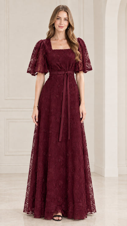 Front view of model wearing burgundy wine lace flutter sleeve maxi gown