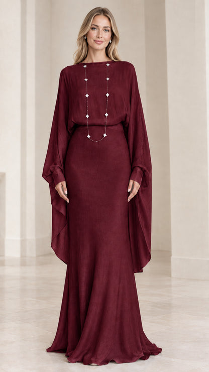 Front view of model wearing burgundy wine draped cape-sleeve maxi evening dress