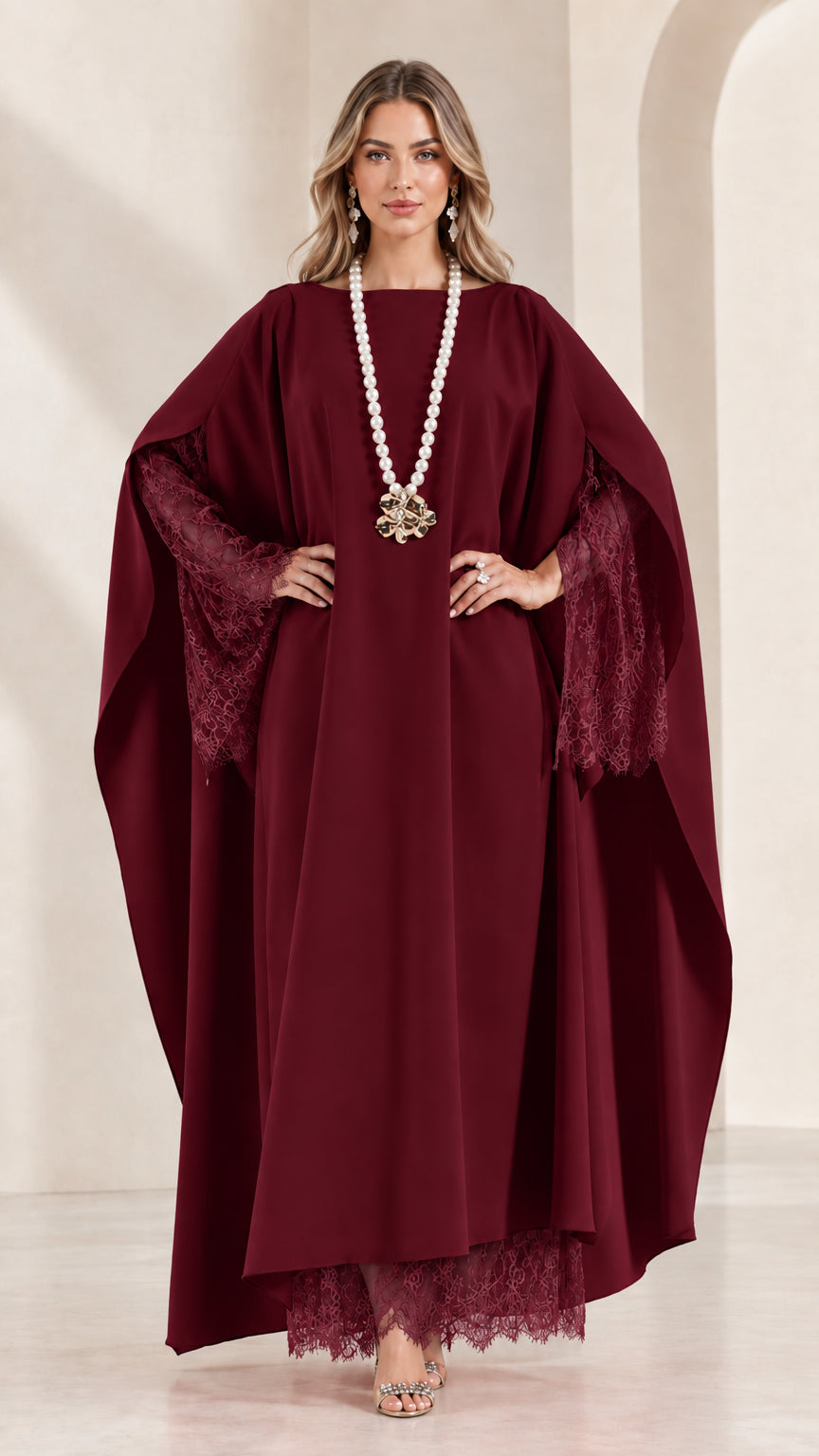 Front view of woman wearing burgundy wine red cape kaftan dress with lace trim