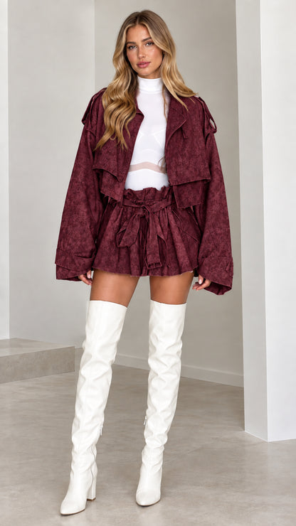 Model wearing Burgundy cropped trench jacket and high-waist belted shorts set