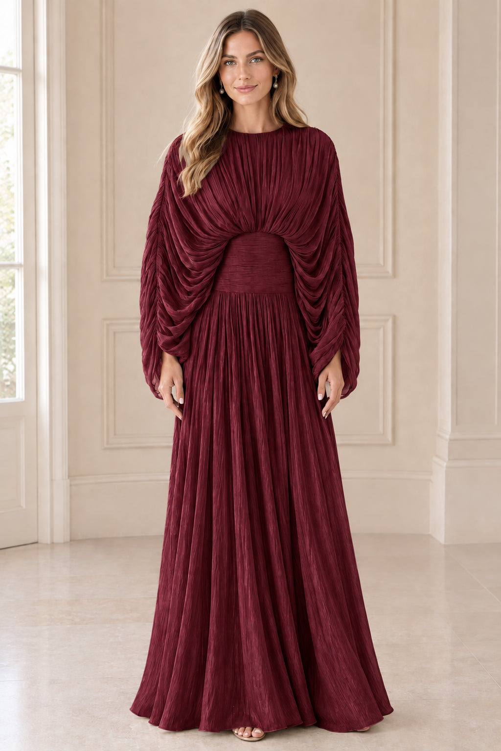 Front view of model wearing Burgundy wine pleated cape sleeve maxi gown